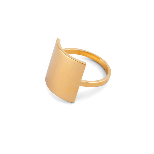 A gold-colored modern square ring with a shield shape design on a white background.