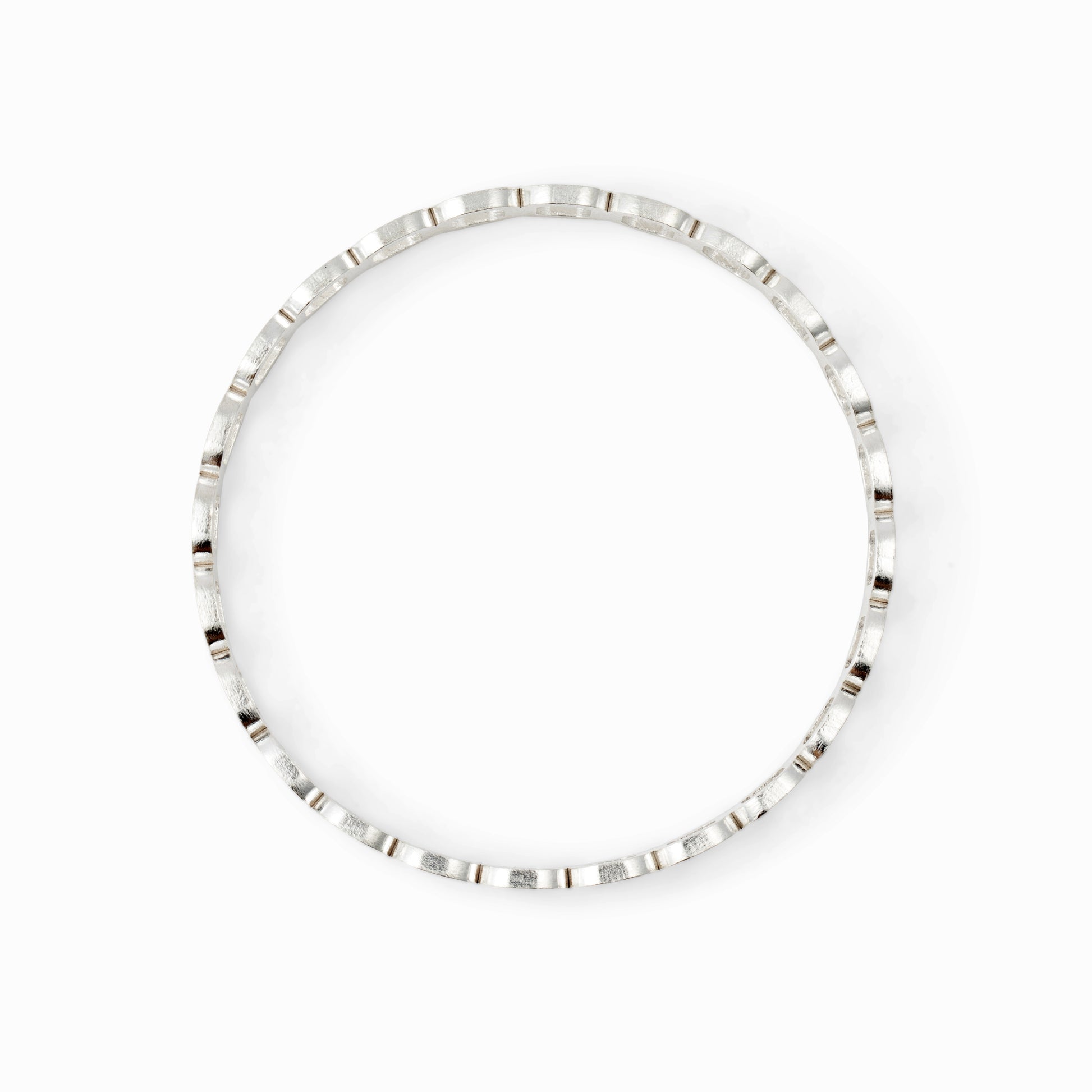 Silver bangle bracelet on a white background