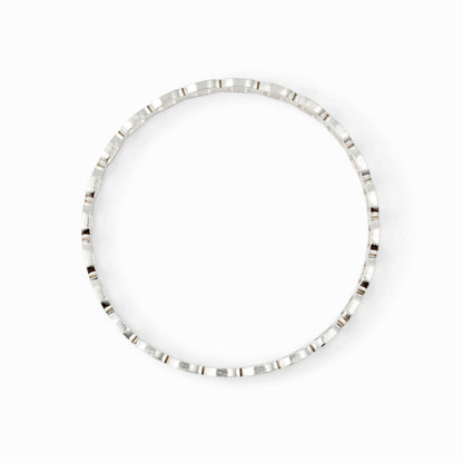 Silver bangle bracelet on a white background
