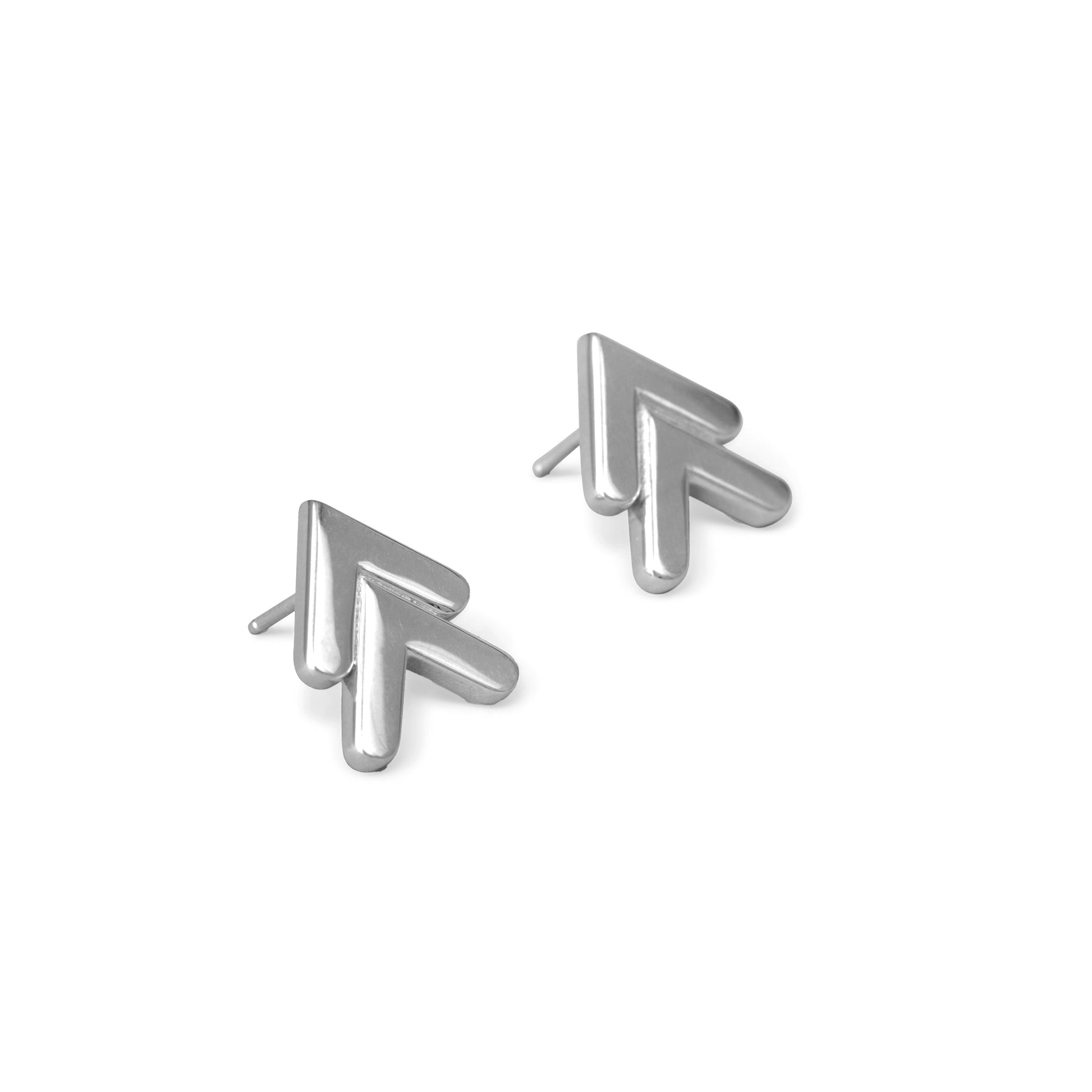 A pair of silver-colored chevron-shaped earrings against a white background.