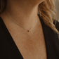 Silver Droplet Water Drop necklace on woman's neck