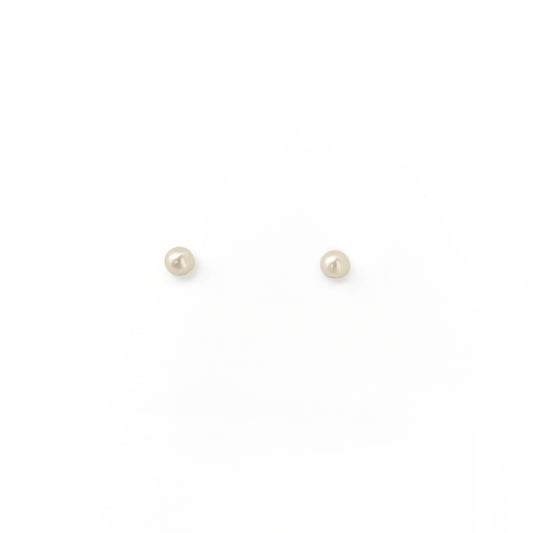 Pair of small pearl stud earrings on a white background
