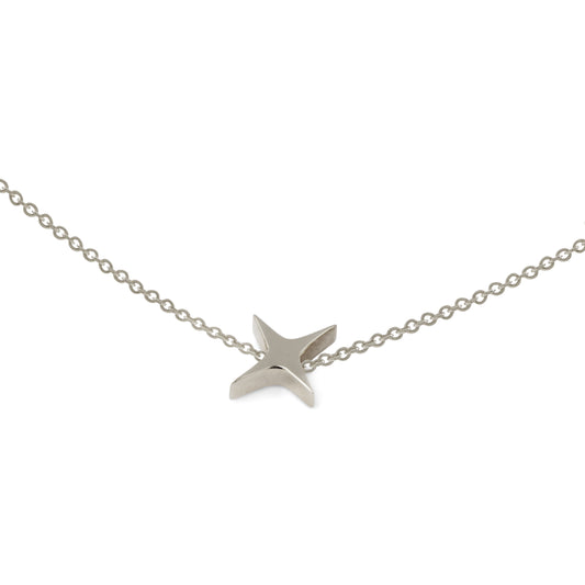 Silver star-shaped pendant jewelry on a chain against a white background