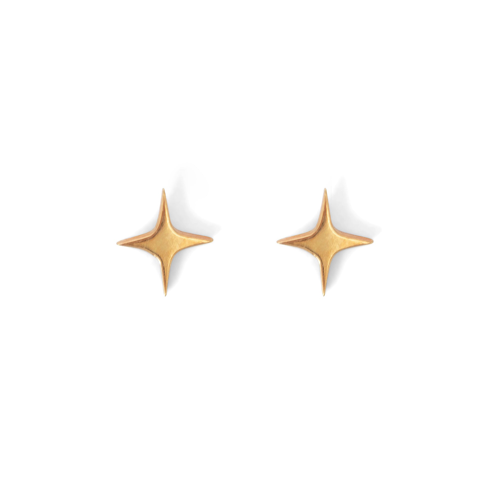 A pair of gold-colored star-shaped stud earrings against a white background.