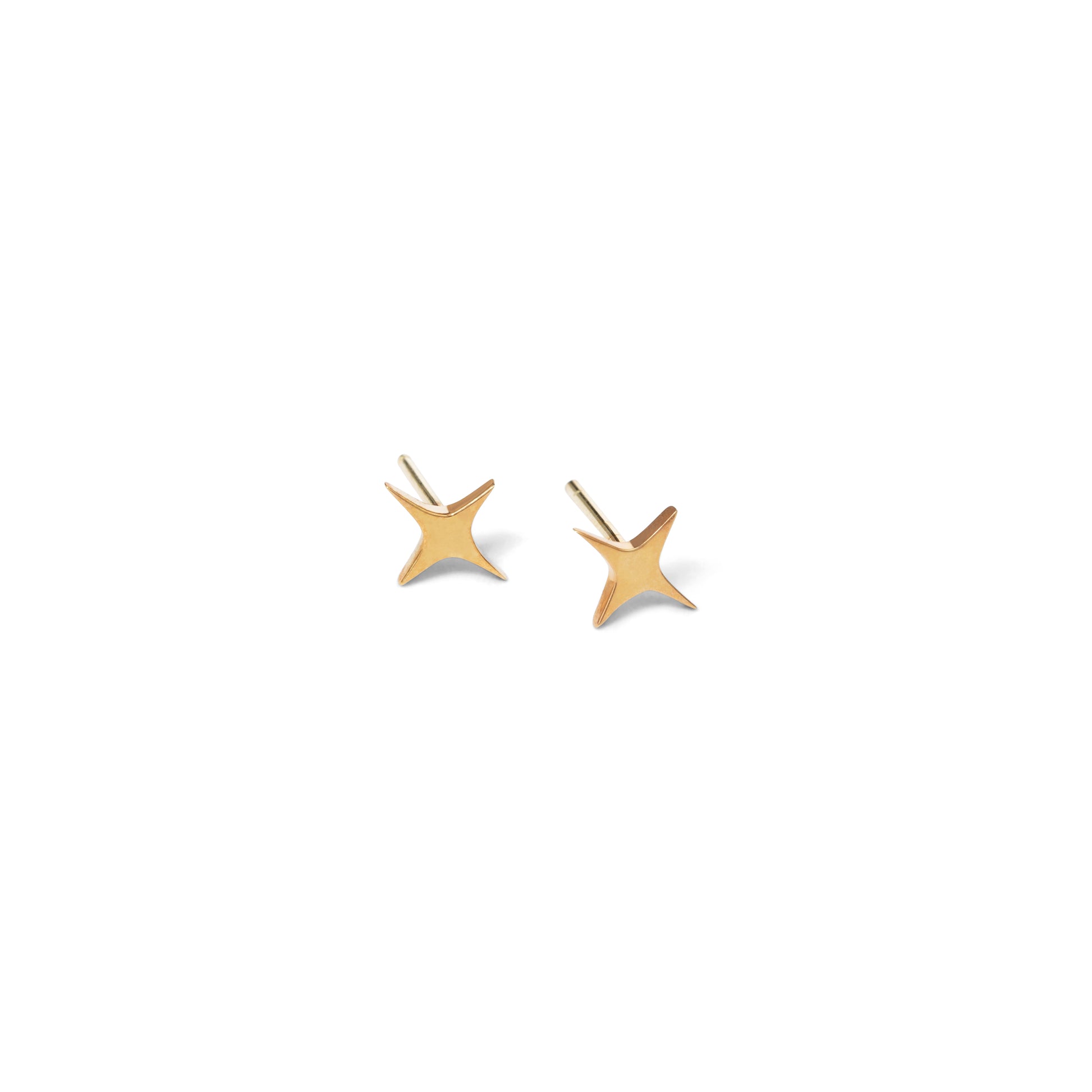 A pair of small, gold-colored star-shaped stud earrings against a white background.