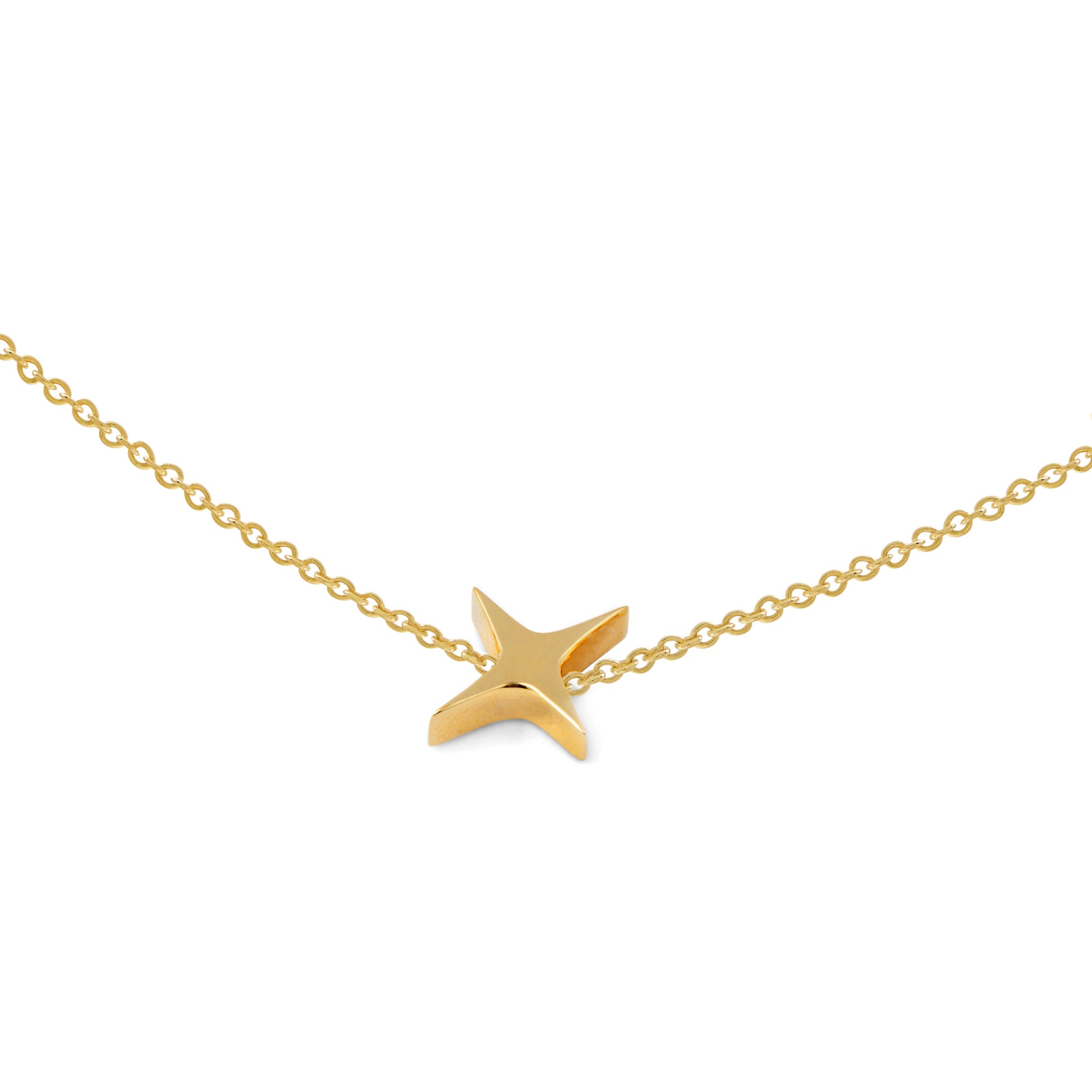 Gold star pendant on a gold chain against a white background