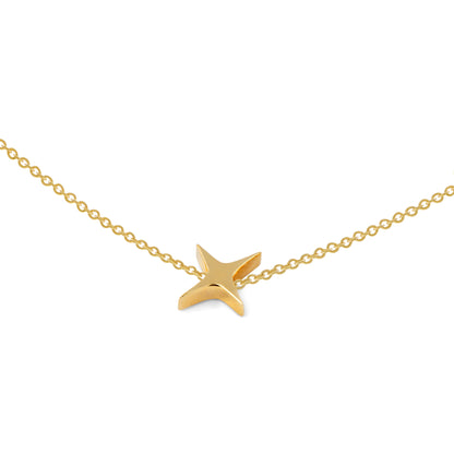 Gold star pendant on a gold chain against a white background