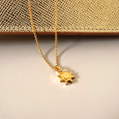 gold sunshine sun necklace product jewelry photo white gold shiny backdrop