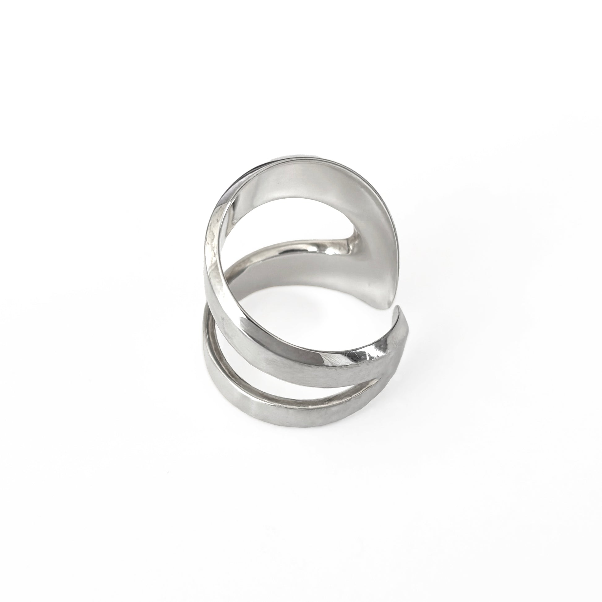 Silver ring with a modern design on a white background