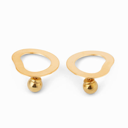 Pair of geometric gold circular earrings against a white background
