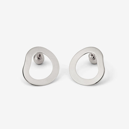 A pair of silver-colored geometric earrings with an open-oval shape accompanied by two small orb-style backings on a white background.