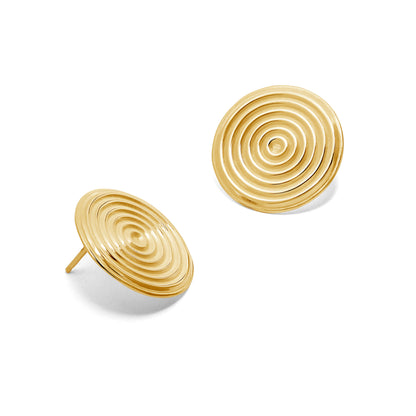 Pair of gold spiral earrings on a white background